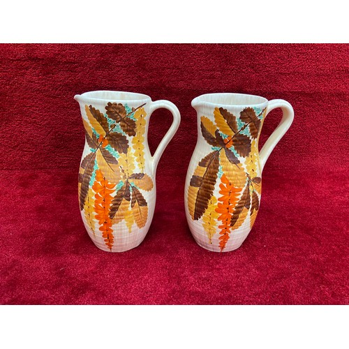 195 - Pair of vintage Bewley pottery hand painted Art Deco jugs. 25cm tall.