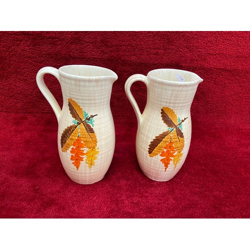 195 - Pair of vintage Bewley pottery hand painted Art Deco jugs. 25cm tall.