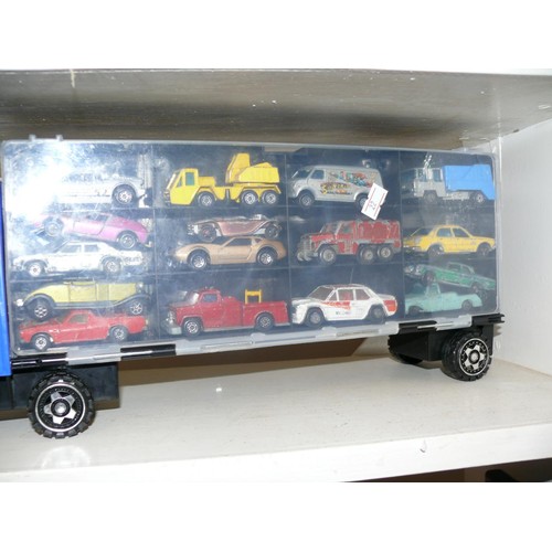 95 - A LARGE LORRY MODEL WITH SIDE STORAGE PANELS WITH APPROXIMATELY 25 MINI DIE CAST MODELS