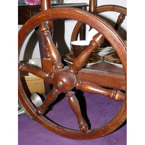 133 - A VINTAGE TILE TOPPED TEA TROLLEY WITH WAGON WHEELS TO ONE END