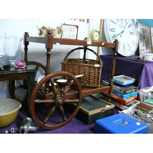 133 - A VINTAGE TILE TOPPED TEA TROLLEY WITH WAGON WHEELS TO ONE END