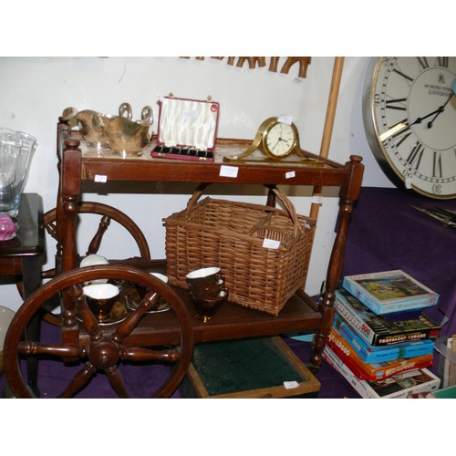 133 - A VINTAGE TILE TOPPED TEA TROLLEY WITH WAGON WHEELS TO ONE END