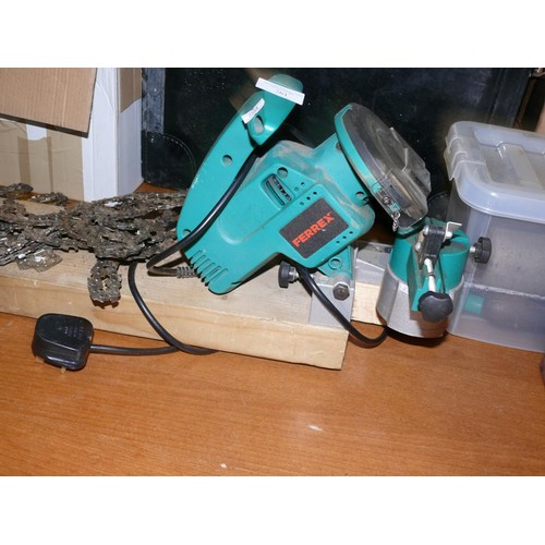 261 - CHAINSAW BLADE SHARPENER AND 2 CHAINS