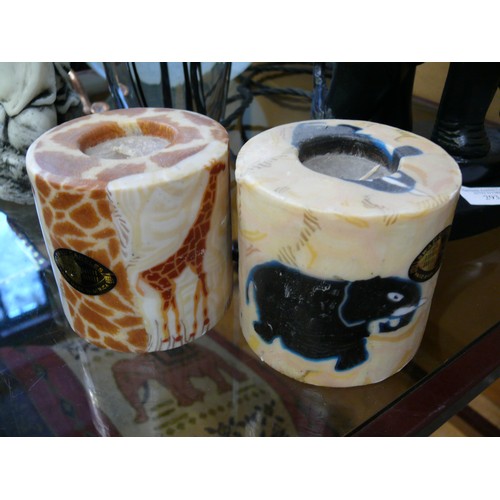 294 - 2 SWAZI CANDLES HAND MADE IN AFRICA 1 WITH ELEPHANTS AND 1 WITH GIRAFFES