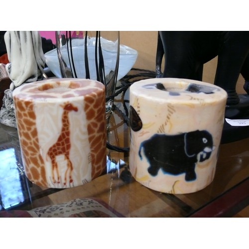 294 - 2 SWAZI CANDLES HAND MADE IN AFRICA 1 WITH ELEPHANTS AND 1 WITH GIRAFFES