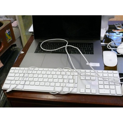 316 - A MACBOOK PRO LAPTOP WITH SPARE KEYBOARD, 2 MICE AND EAR BUDS