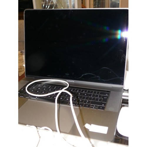 316 - A MACBOOK PRO LAPTOP WITH SPARE KEYBOARD, 2 MICE AND EAR BUDS