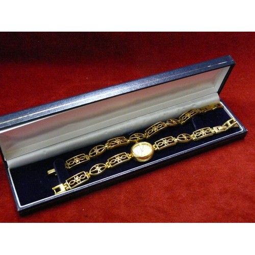 7 - LADIES SEKONDA WRIST WATCH & BRACELET SET - GOLD PLATED. THE STRAP & BRACELET SET WITH DIAMANTE