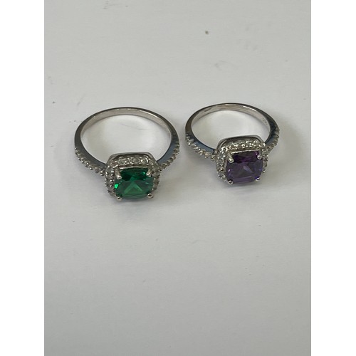 58 - 2 SOLID SILVER DRESS RINGS 1 WITH BRIGHT GREEN STONE SIZE R 1/2  PURPLE SIZE M BOTH SURROUNDED BY WH... 