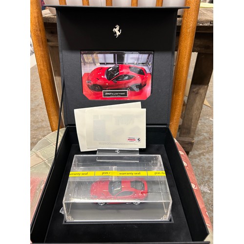 14 - A SUPERB FERRARI OFFICIAL PRODUCT 812 SUPERFAST DIE CAST MODEL CAR IN RED WITH A STAND AND PRESENTAT... 