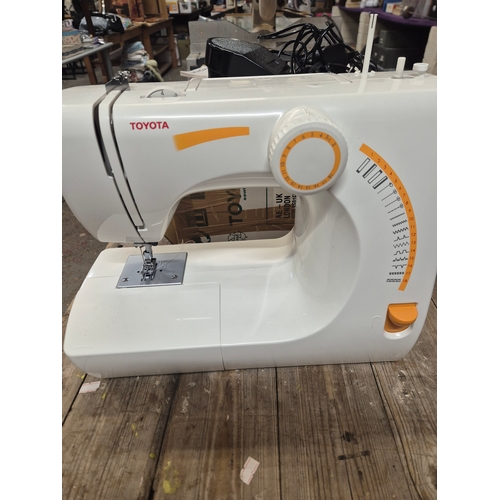 58A - TOYOTA RS2000 SEWING MACHINE WITH BOX, PEDAL AND INSTRUCTIONS