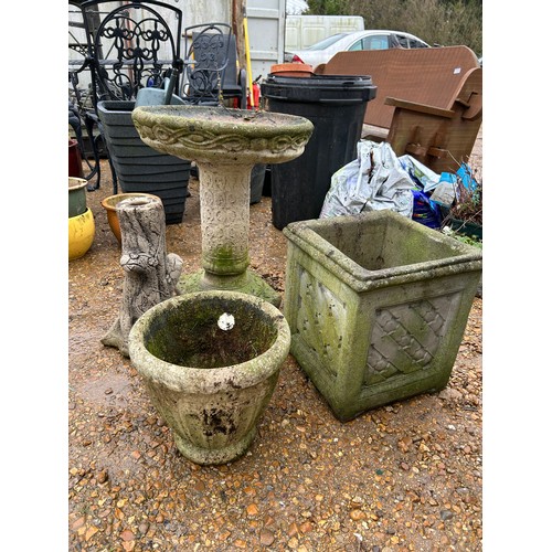 417 - Artificial stone garden items to include a bird bath, square planter, round planter and a tree stump