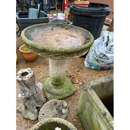 417 - Artificial stone garden items to include a bird bath, square planter, round planter and a tree stump