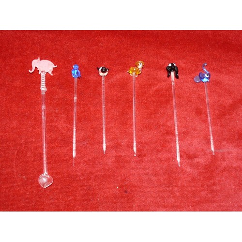 21 - A group of glass cocktail stirrer sticks with animal finials.