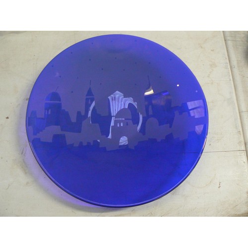 280 - Cobalt blue art glass plate, etched with a middle eastern city skyline. 40.5cm diameter.