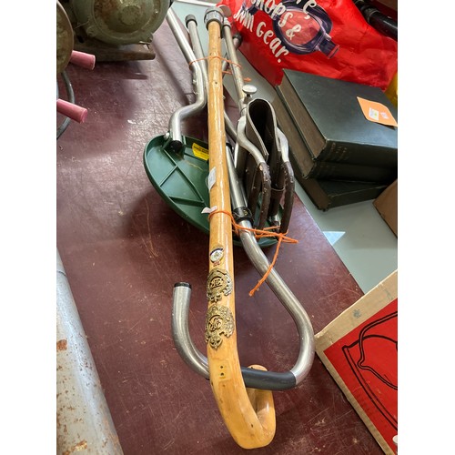 298 - A SHOOTING STICK WITH LEATHER SEAT, FOLDING STOOL STICK AND A WALKING STICK WITH MILITARY BADGES 'RO... 