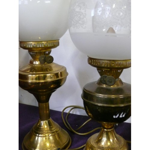 114 - 2 VINTAGE OIL LAMP ELECTRIC LIGHTS WITH BRASS BASES AND GLASS FUNNELS AND GLOBES