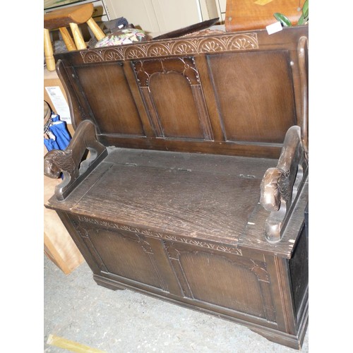 437 - VINTAGE DARK WOOD METAMORPHIC BENCH/TABLE WITH LION ARMS AND LIFT UP TOP FOR STORAGE