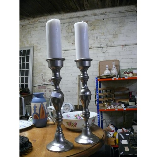 260 - PAIR OF LARGE SILVER CANDLESTICKS WITH WHITE CANDLES