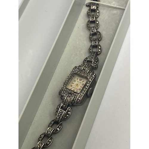 35 - An Art Deco silver and marcasite cocktail watch with integral strap, circa 1912.