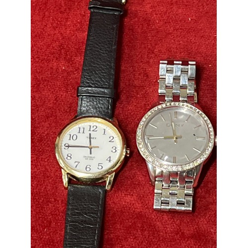 27 - GENTS DKNY WATCH ON STEEL STRAP AND A TIMEX INDIGLO - BOTH WORKING