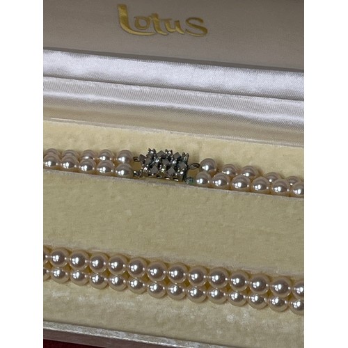 56 - VINTAGE DOUBLE STRAND OF SIMULATED LOTUS PEARLS WITH ORIGINAL BOX, DIAMANTE CLASP