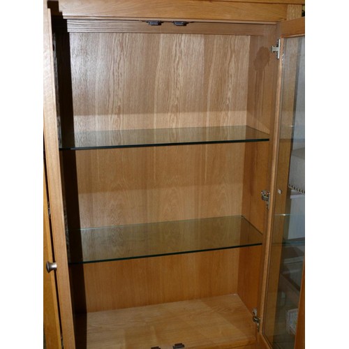 512 - LARGE OAK DISPLAY CABINET WITH GLAZED DOORS TO TOP AND CUPBOARD BELOW