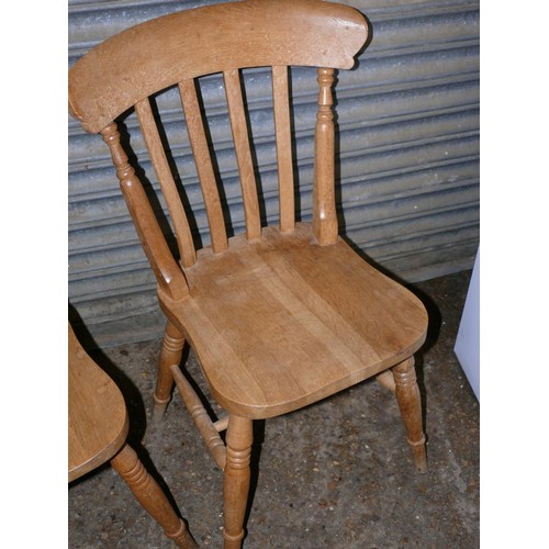 509 - A PAIR OF BEECH DINING CHAIRS WITH SPINDLE BACKS PLUS A FURTHER PAIR WITH SLAT BACKS