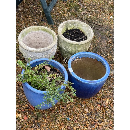 527 - A PAIR OF CONCRETE PLANT POTS AND A PAIR OF BLUE GLAZED PLANT POTS