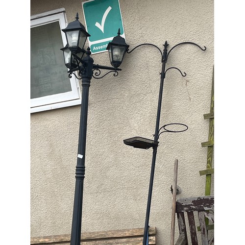 554 - LARGE METAL GARDEN LAMPOST AND A BIRD FEEDER STAND