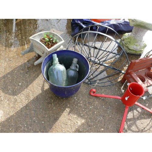 557A - A BIRDBATH, 4 PLANTERS, CHRISTMAS TREE STAND, 2 BIKE STANDS, FOLDING CHAIR AND AN AXE