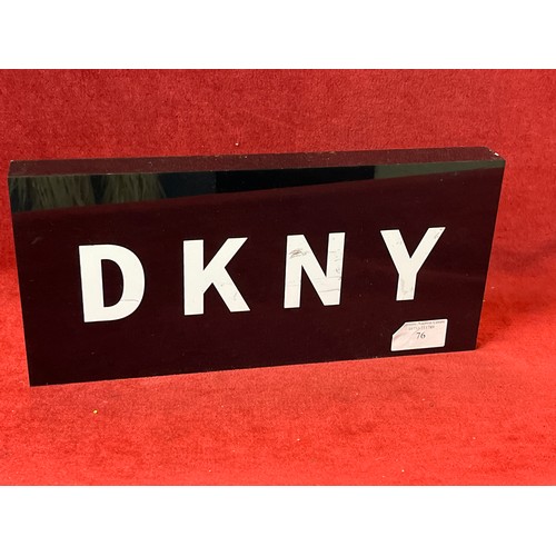 76 - DKNY ADVERTISING PLAQUE IN BLACK AND WHITE