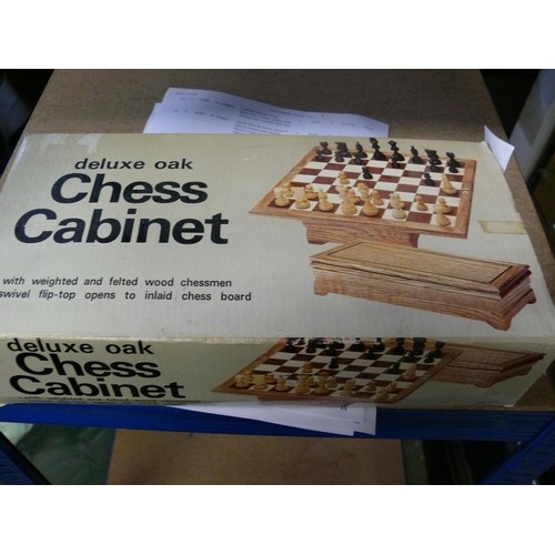 198 - A DELUXE OAK CHESS CABINET PLUS A FURTHER CHESS SET WITH BOARD