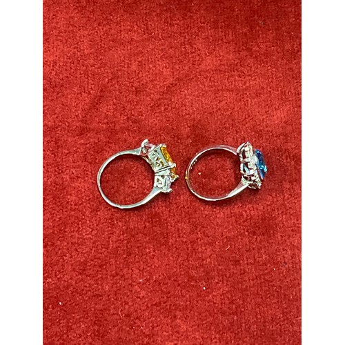 37 - TWO 925 SILVER RINGS SET WITH AN AQUAMARINE COLOURED CRYSTAL AND A SQUARE CUT CITRINE COLOUR CRYSTAL... 