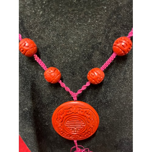 29 - CHINESE CINNABAR LACQUER SHOU BEADED PENDANT NECKLACE