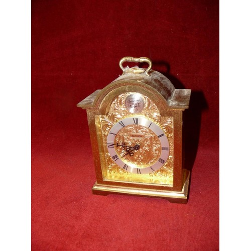 87 - A HEAVY BRASS MECHANICAL MANTLE CLOCK BY SWIZA