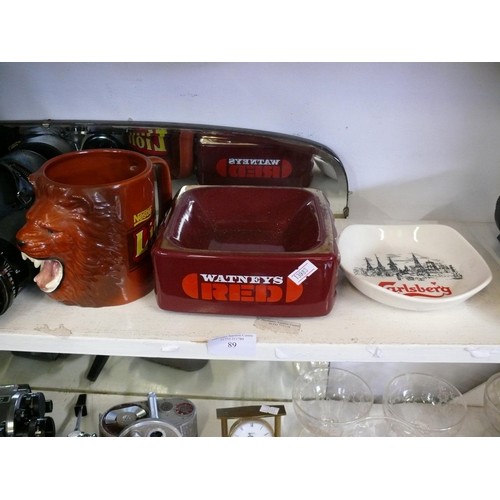 89 - NESTLE LION MUG, WATNEYS RED ASHTRAY AND CARLSBERG ASHTRAY