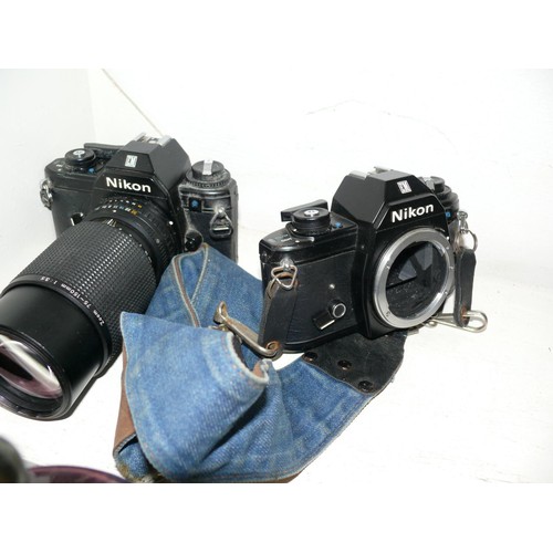 92 - 2 NIKON CAMERAS PLUS A LARGE LENS AND NIKON WIDEANGLE CONVERTER