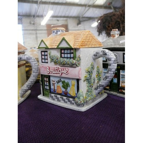 122 - 6 CERAMIC TEAPOTS FROM 'THE VILLAGE COLLECTION' BY ANNIE ROWE FLORIST, THE RED LION, CHEMIST, BOUTIQ... 