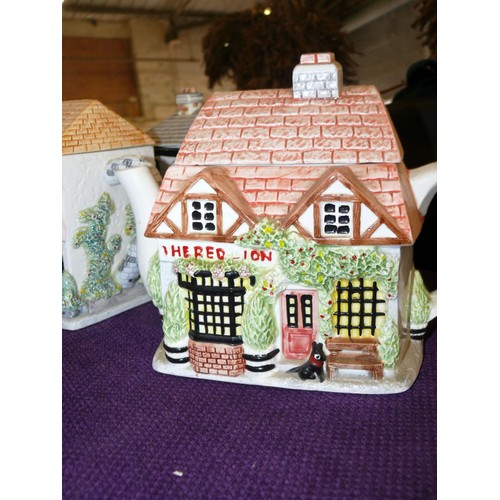 122 - 6 CERAMIC TEAPOTS FROM 'THE VILLAGE COLLECTION' BY ANNIE ROWE FLORIST, THE RED LION, CHEMIST, BOUTIQ... 