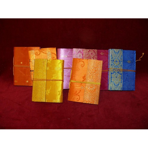 184 - 8 SILK COVERED NOTEBOOKS WITH HANDMADE PAPER, 2 BROCADE SPECTACLES CASES AND 5 FANS