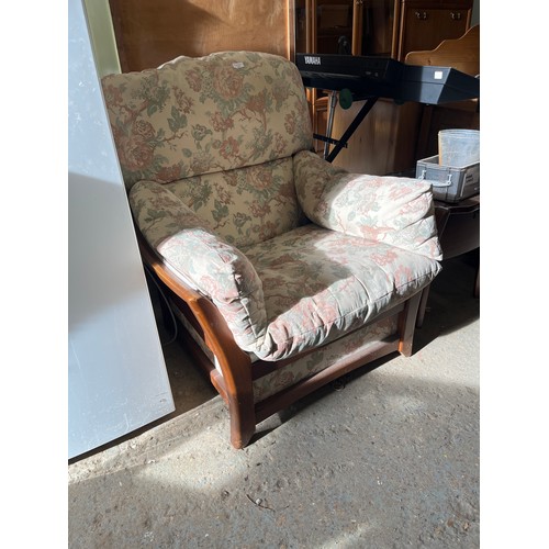 409 - LARGE COMFORTABLE WOODEN FRAMED ARMCHAIR