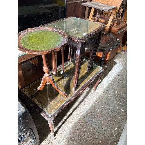 412 - GREEN LEATHER AND GLASS TOPPED COFFEE TABLE PLUS NEST OF 3 TABLES AND A SMALL WINE TABLE