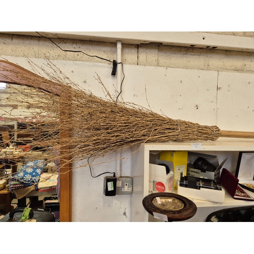 83 - LARGE BROOMSTICK WITH WOODEN HANDLE