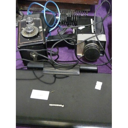 140 - HALINA SUPER CINE CAMERA, REFLECTA LENSE AND A PANASONIC CAR DVD PLAYER