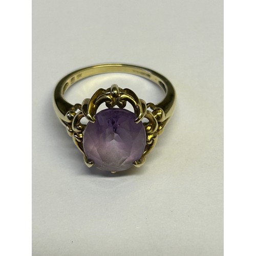 19 - A LARGE SIZE OLD STYLE 9ct GOLD AMETHYST RING SIZE P WEIGHT 4.8gr