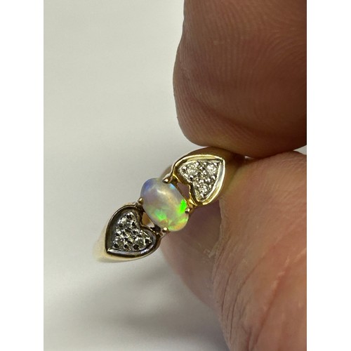 20 - A 9ct GOLD DIAMOND AND FIRE OPAL REALLY MULTI COLOURS SIZE P WEIGHT 2.38gr