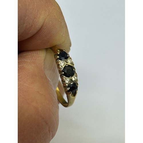 24 - A 9ct GOLD SAPPHIRE AND DIAMOND  ENGAGEMENT RING SIZE W WEIGHT 1.84gr