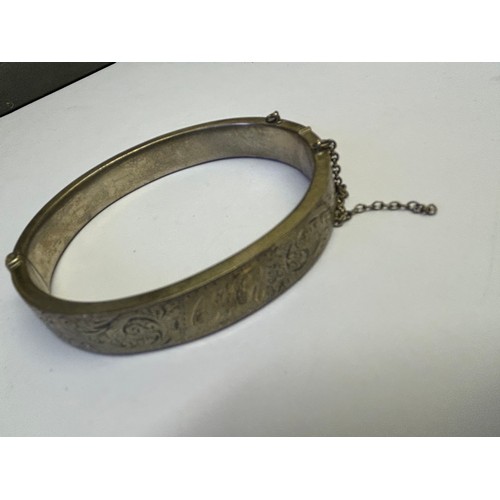 46 - A SILVER BRACELET BANGLE DETAILED CARVING ONE SIDE WEIGHT 19.34GR