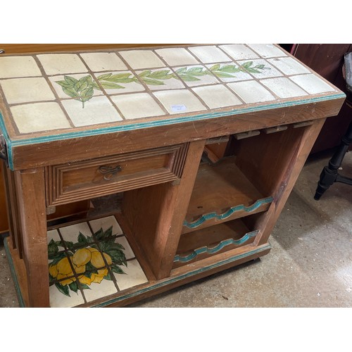348 - VERY NICE VINTAGE TILE TOPPED DRINKS TROLLEY WITH GLASS AND BOTTLE STORAGE PLUS A DRAWER